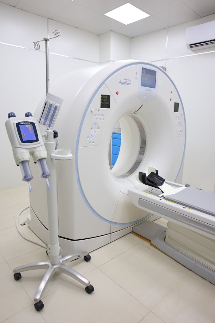 gallery-3 Bright hospital room featuring a modern MRI machine and related technology.